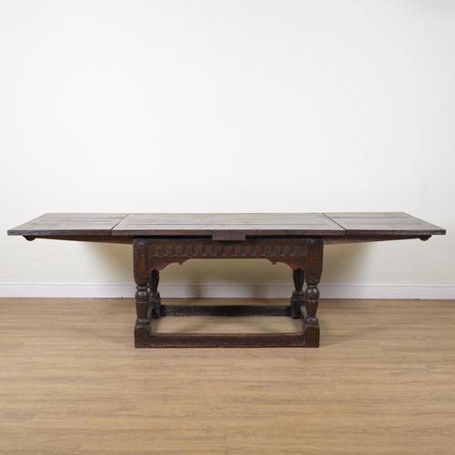 A 17TH CENTURY AND LATER OAK DRAW LEAF EXTENDING TABLE