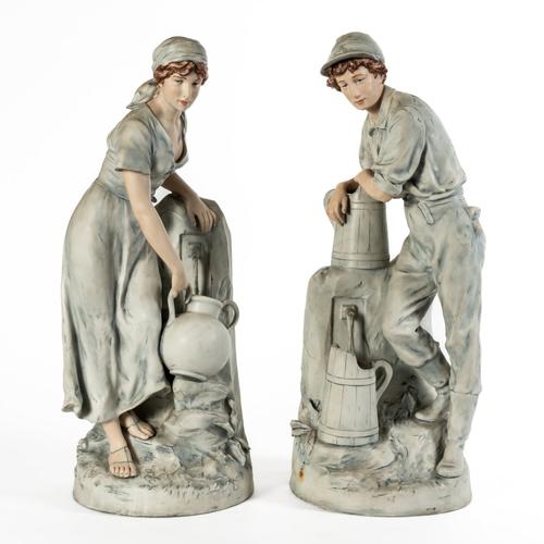 ROYAL DUX; A LARGE PAIR OF FIGURES OF A WATERBOY AND MAIDEN AT A WELL (2)