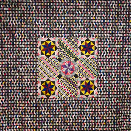 A LARGE VICTORIAN SILK PATCHWORK WALL HANGING OR BEDSPREAD