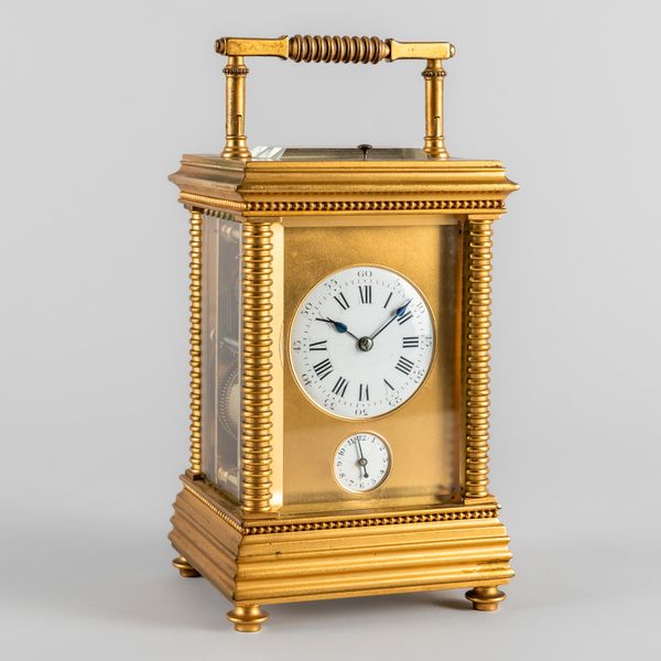 A FRENCH GILT BRASS STRIKING AND REPEATING LEVER CARRIAGE CLOCK WITH ALARM