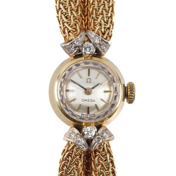 AN OMEGA 18CT GOLD AND DIAMOND LADY'S DRESS BRACELET WRISTWATCH