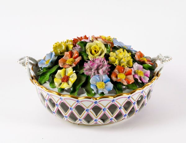 A HEREND TWO-HANDLED CIRCULAR RETICULATED BASKET OF FLOWERS