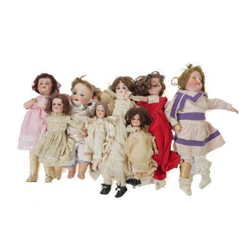 A GROUP OF EIGHT GERMAN AND FRENCH BISQUE HEAD DOLLS (8)