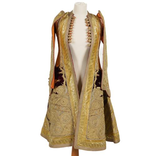 AN ALBANIAN OTTOMAN GOLD AND SILVER THREAD EMBROIDERED PURPLE VELVET PIRI-PIRI TUNIC OR WEDDING TUNIC