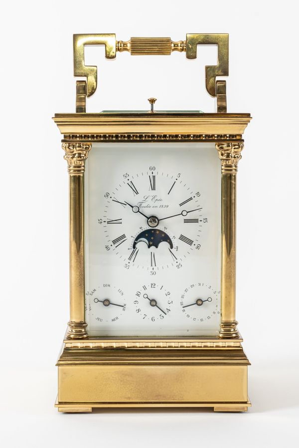 A FRENCH BRASS STRIKING AND REPEATING ALARM CARRIAGE CLOCK WITH MOONPHASE AND CALENDAR