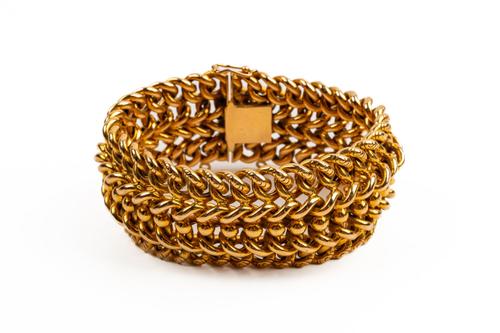 A WIDE GOLD BRACELET