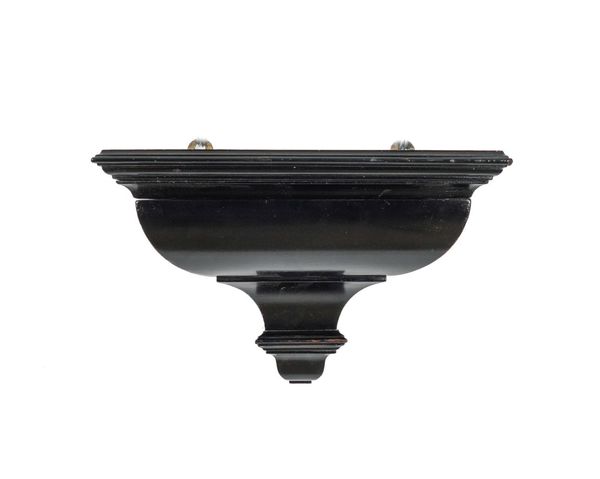 A GEORGE II STYLE EBONISED CLOCK BRACKET WITH CONCEALED DRAWER