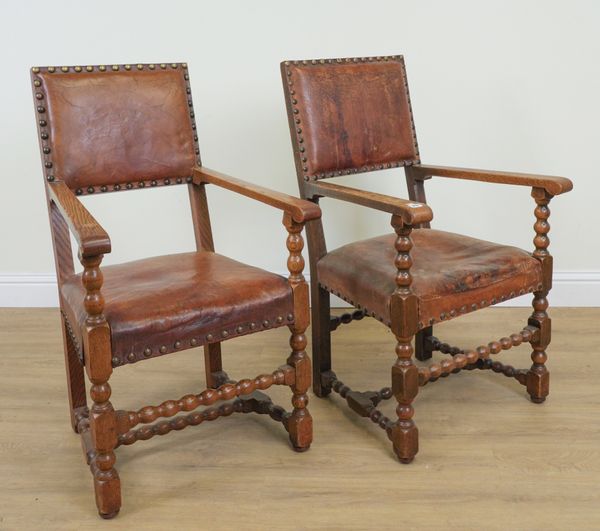 A PAIR OF CHARLES II STYLE OAK OPEN ARMCHAIRS (2)