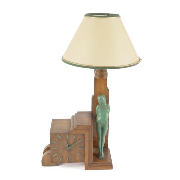 AN ART DECO BRONZE MOUNTED WALNUT FIGURAL LAMP WITH CLOCK BASE