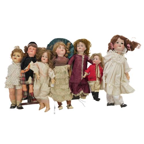 SEVEN ARMAND MARSEILLE BISQUE HEAD DOLLS (7)