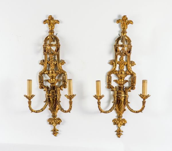 A PAIR OF LOUIS XVI STYLE GILT-METAL TWIN LIGHT WALL APPLIQUES (2)