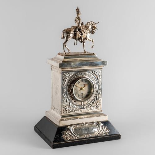 XII ROYAL LANCERS - A SILVER AND SILVER PLATE PRESENTATION MANTEL TIMEPIECE TO MAJOR HOWARD CLIFTON BROWN