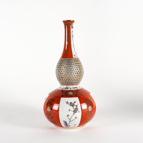 A HEREND IRON-RED GROUND PART RETICULATED DOUBLE GOURD VASE