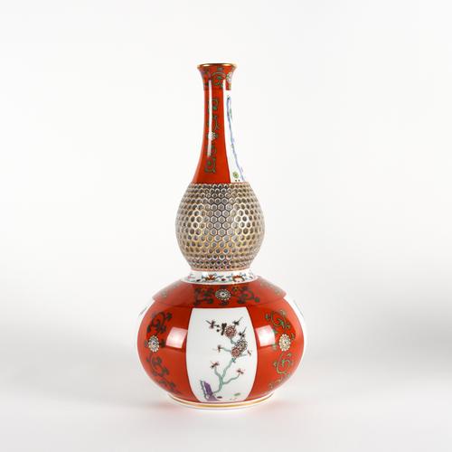 A HEREND IRON-RED GROUND PART RETICULATED DOUBLE GOURD VASE