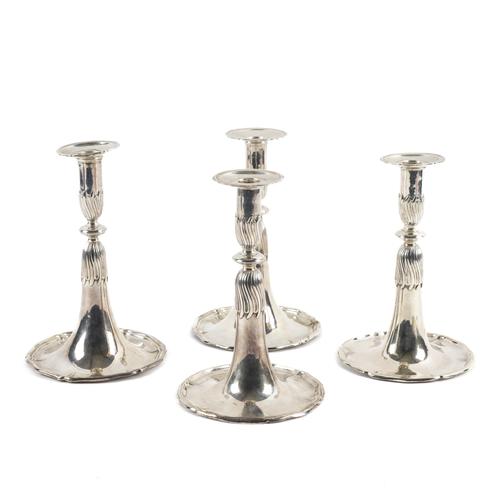 A SET OF FOUR EUROPEAN SILVER TABLE CANDLESTICKS (4)