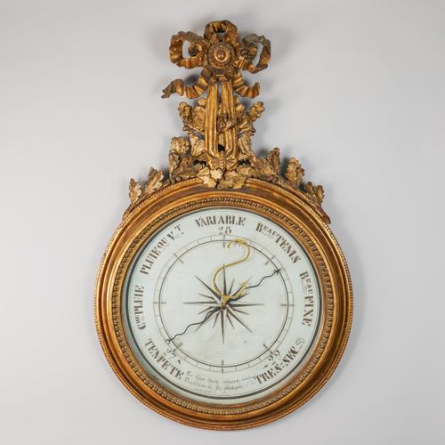 A LATE LOUIS XVI PROVINCIAL GILTWOOD AND GESSO BAROMETER