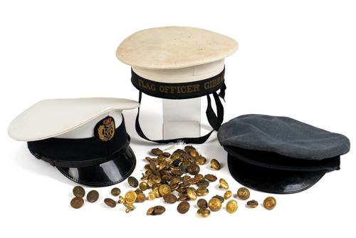 THREE MILITARY CAPS AND A BOX OF BUTTONS