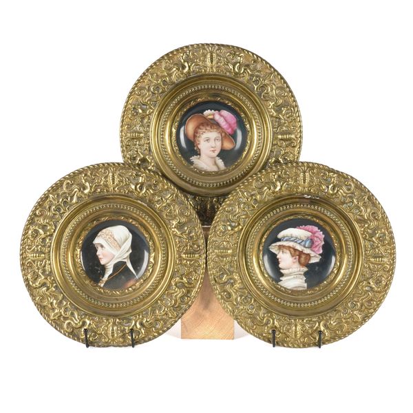 THREE AUSTRIAN HAND PAINTED EMBOSSED BRASS MOUNTED PORTRAIT PLATES (3)