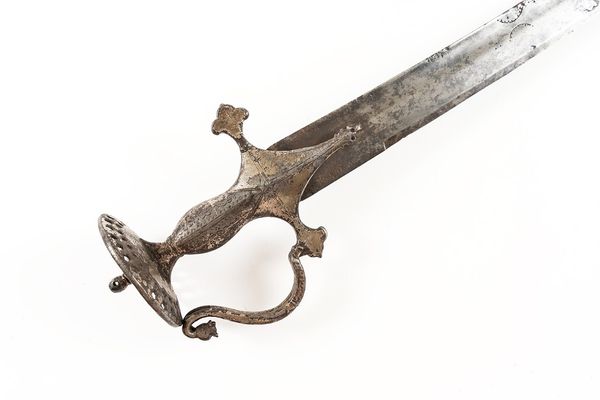 AN INDIAN TALWAR WITH PIERCED DISC POMMEL