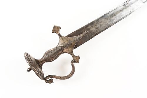 AN INDIAN TALWAR WITH PIERCED DISC POMMEL