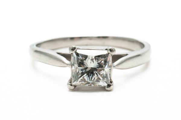 A SINGLE STONE PRINCESS CUT DIAMOND RING