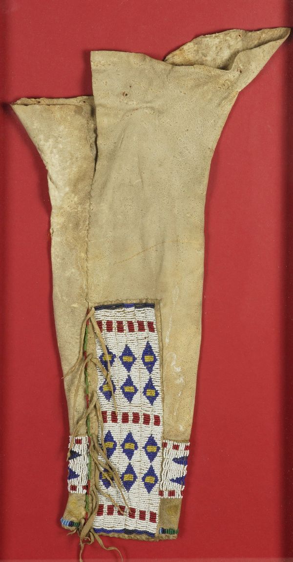 A NATIVE AMERICAN CHEYENNE GLASS SEED BEADWORK AND HIDE CHILD'S LEGGING TOGETHER WITH OTHER ITEMS (4)