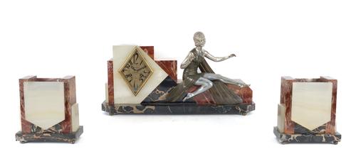 A FRENCH ART DECO RED MARBLE AND ALABASTER FIGURAL THREE-PIECE CLOCK GARNITURE (3)