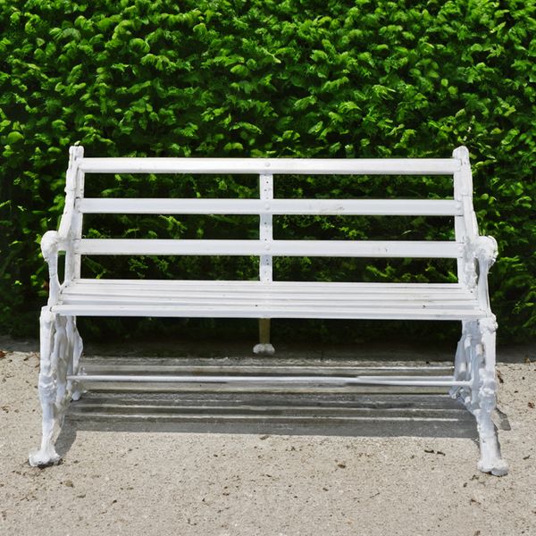 COALBROOKDALE;  A WHITE PAINTED CAST IRON HOUND AND SERPENT PATTERN GARDEN BENCH