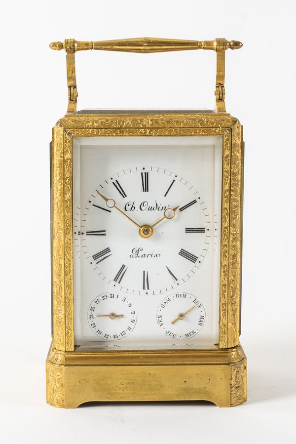 AN EARLY FRENCH ENGRAVED GILT BRASS ONE-PIECE CASE STRIKING CALENDAR CARRIAGE CLOCK