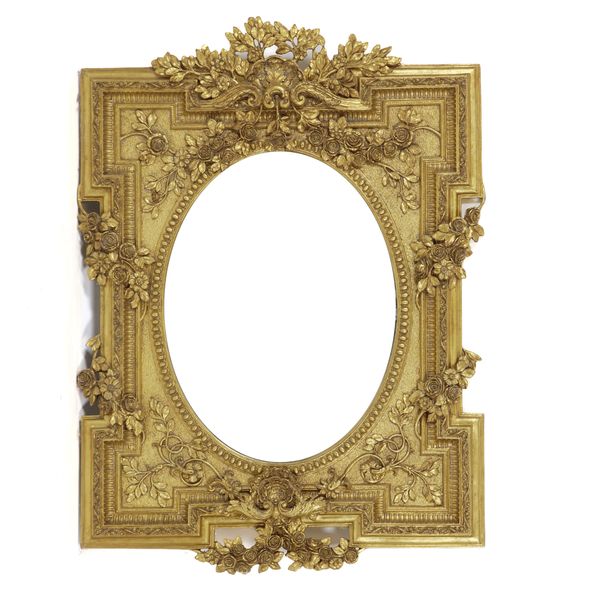 A VICTORIAN STYLE GILT FRAMED OVAL WALL MIRROR