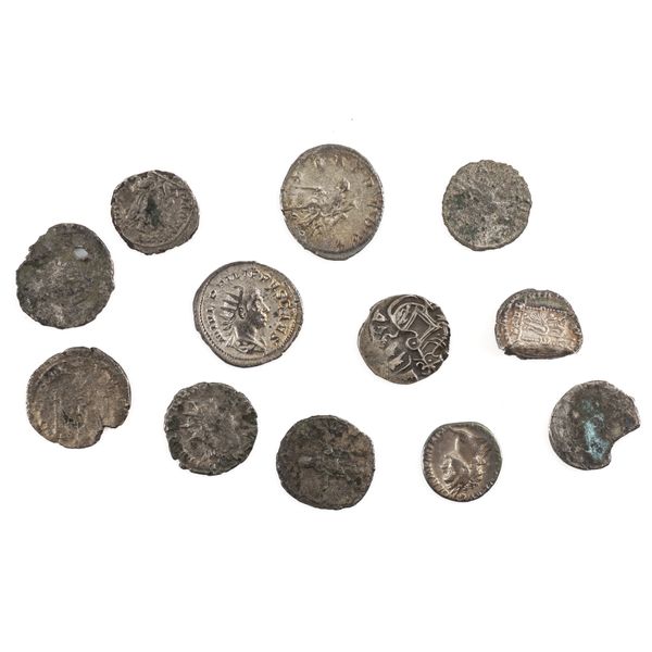 A GROUP OF TWELVE MOSTLY ROMAN SILVER AND DEBASED SILVER COINS