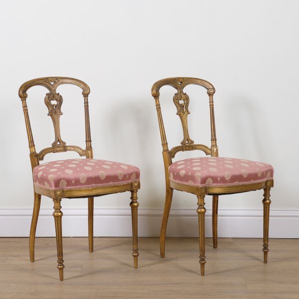 A PAIR OF LATE 19TH CENTURY GILT FRAMED SIDE CHAIRS (2)