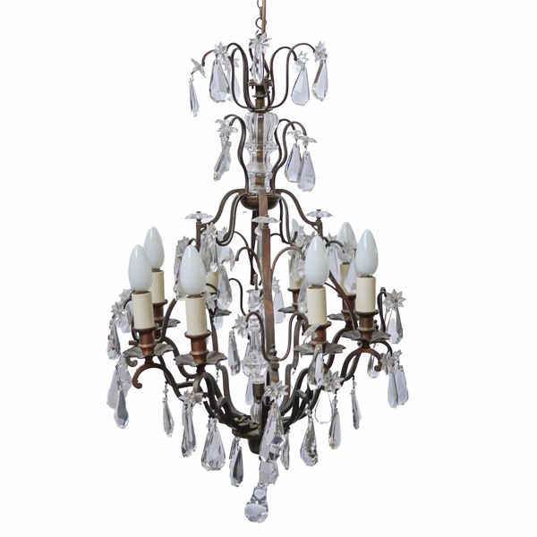 A COPPER AND GLASS EIGHT LIGHT CHANDELIER