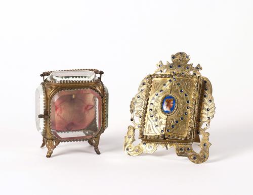 AN AUSTRIAN GILT-METAL AND ENAMEL FRAME AND A POCKET-WATCH STAND (2)
