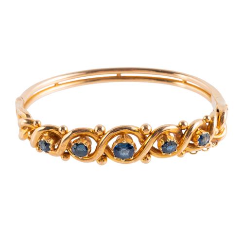 A SAPPHIRE SET FIXED BANGLE (2)