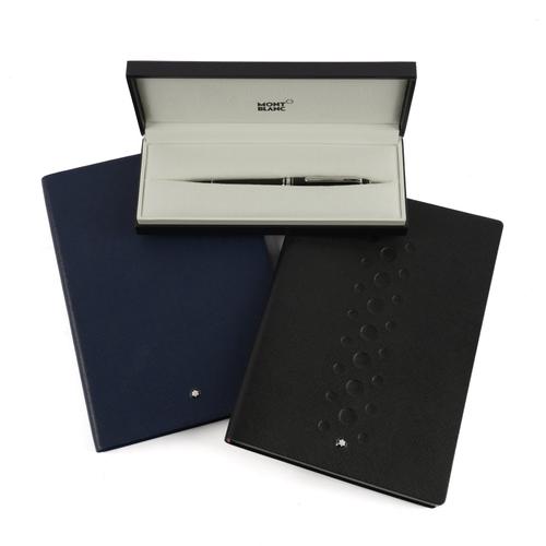 MONT BLANC: A BALLPOINT PEN AND TWO LEATHER NOTEBOOKS (3)