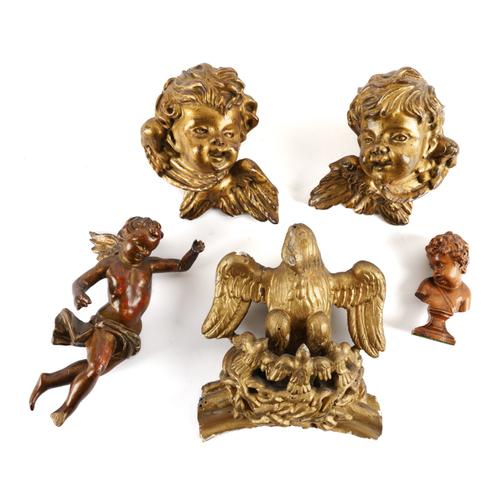 A CONTINENTAL CARVED BOXWOOD BUST OF CHILD AND GILTWOOD CHERUB HEADS (5)