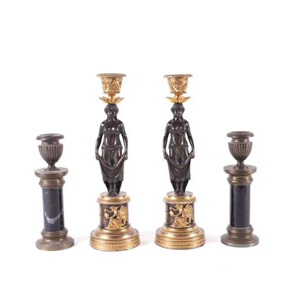 A PAIR OF EMPIRE STYLE GILT AND PATINATED BRONZE CARYATID CANDLESTICKS (4)