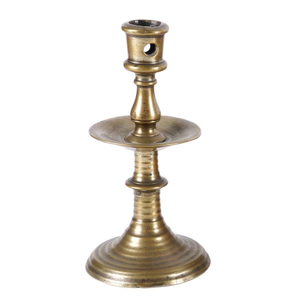 A FLEMISH 'HEEMSKIRK' BRASS CANDLESTICK