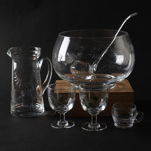 WILLIAM YEOWARD: A GROUP OF 'WISTERIA' PATTERN COUNTRY RANGE DRINKING GOBLETS INCLUDING A PUNCH BOWL AND CUPS WITH A LADLE (22)