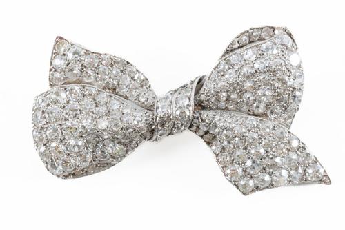 A DIAMOND BOW BROOCH