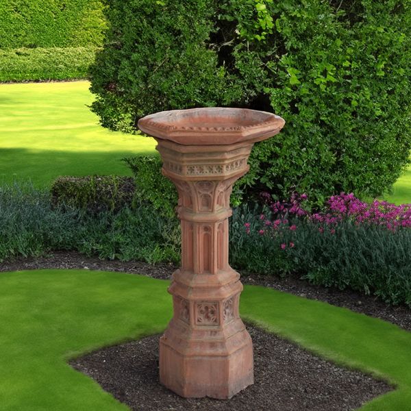 A GOTHIC REVIVAL TERRACOTTA OCTAGONAL BIRD BATH