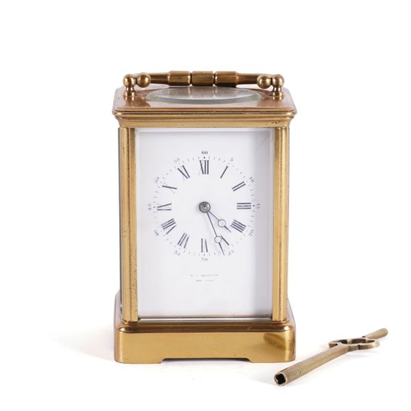 AN ENGLISH LACQUERED BRASS CORNICHE CARRIAGE CLOCK