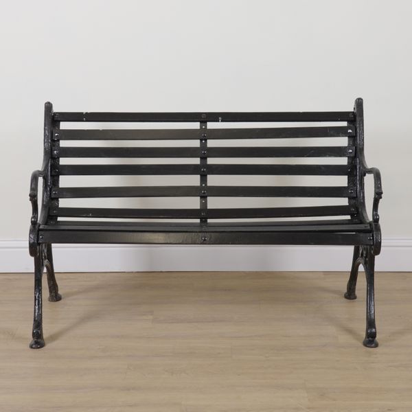 A VICTORIAN BLACK PAINTED CAST IRON GARDEN BENCH