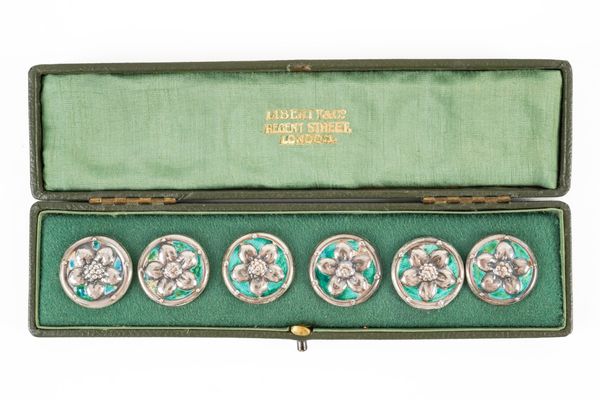 A SET OF SIX LIBERTY AND CO SILVER AND ENAMELLED BUTTONS (6)