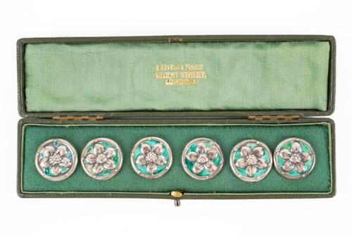 A SET OF SIX LIBERTY AND CO SILVER AND ENAMELLED BUTTONS (6)