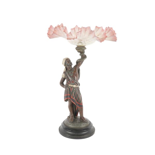 A FRENCH COLD PAINTED SPELTER FIGURE OF AN ARAB TORCH BEARER