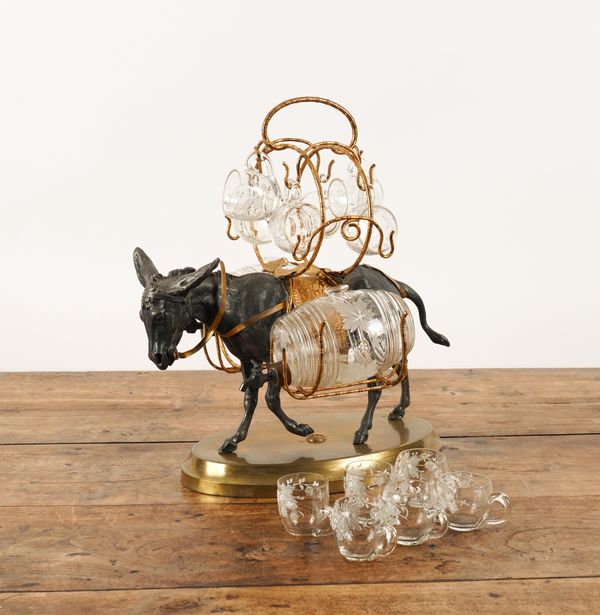 A CONTINENTAL GLASS MOUNTED GILT AND SILVERED METAL DONKEY CAVE À LIQUEUR