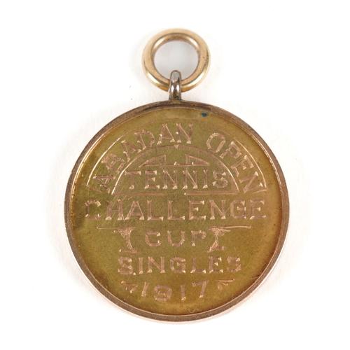 A IRANIAN GOLD FOB MEDAL