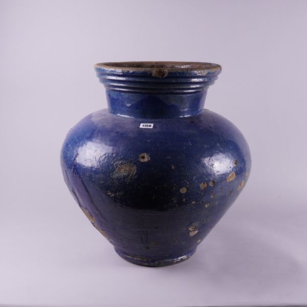 A LARGE BLUE GROUND POTTERY VASE